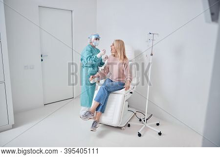 Nurse Performing A Pharyngeal Swab In The Woman