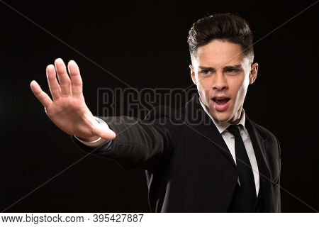 Professional Bodyguaard In A Black Suit Screaming Gesturing With His Palm To Stom Aggressive Protect