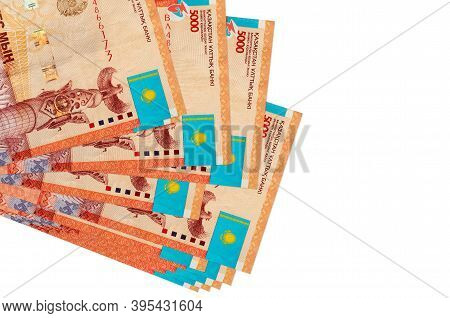 5000 Kazakhstani Tenge Bills Lies In Small Bunch Or Pack Isolated On White. Mockup With Copy Space. 