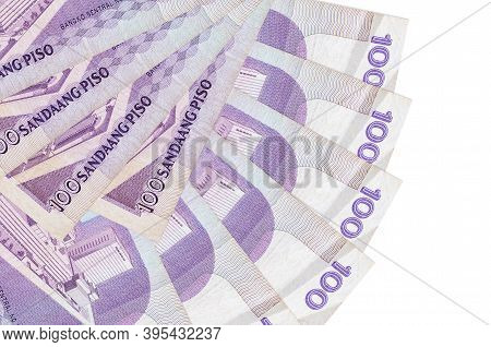 100 Philippine Piso Bills Lies Isolated On White Background With Copy Space Stacked In Fan Shape Clo