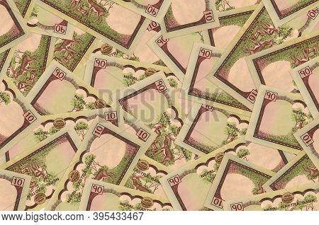 10 Nepalese Rupees Bills Lies In Big Pile. Rich Life Conceptual Background