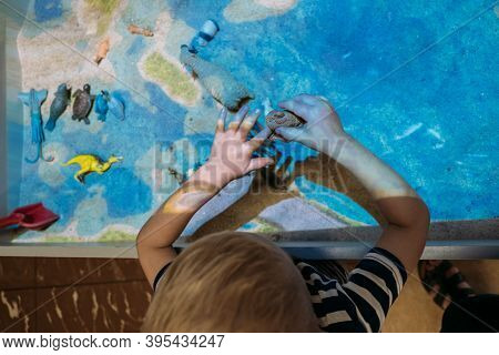 Kids Play With Augmented Reality Sandbox. Interactive Sandbox, Educational And Entertaining World Fo