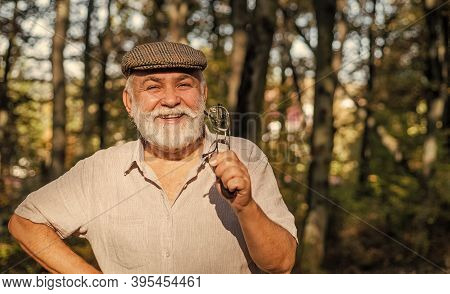 Eye Care. Happy Pensioner Hold Glasses In Nature. Old Man Have Long Sight. Old Age Sight. Failing Si