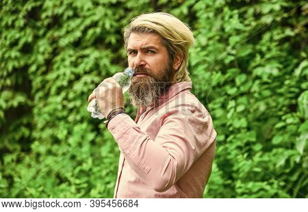 Drinking Water. Handsome Man Drinking Fresh Water From Bottle. Morning Routine. Daily Intake Of Wate