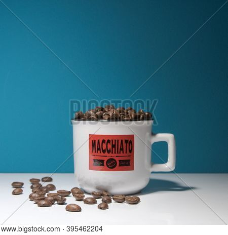 Mokachino Cup With Coffe Beans Close Up