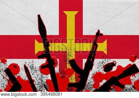 Guernsey Flag And Various Weapons In Red Blood. Concept For Terror Attack Or Military Operations Wit