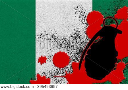 Nigeria Flag And Mk2 Frag Grenade In Red Blood. Concept For Terror Attack Or Military Operations Wit