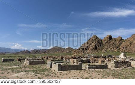 Bayan Olgi, Mongolia, August 5, 2019: Gravestones And Graveyard In The Steppe Of Mongolia With Mount