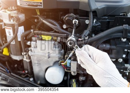 Repairing  Outboard Marine Engine. Motorboat Engine Seasonal Service And Maintenance. Mechanic Yfnd
