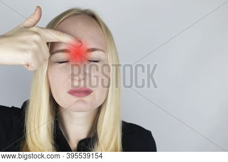 Nasal Bridge Pain, Headache. A Woman Holds His Nose With His Hand And Winces In Pain. Signs Of Acute