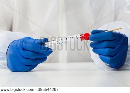 Lab Technician Holding Swab Collection Kit,coronavirus Covid-19 Specimen Collecting Equipment,dna Na