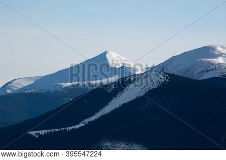 Winter morning. Snowy mountains. Winter