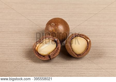 Macadamia Nuts - Macadamia Integrifolia; Photo On Wooden Background.