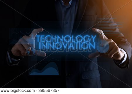 Business Man Hands Holding Inscription Technology Innovation With Different Graphs On The Background