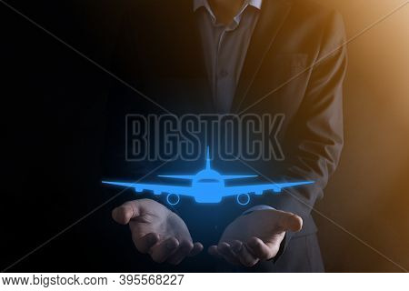 Businessman Holding An Airplane Icon In His Hands. Online Ticket Purchase.travel
