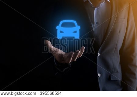 Digital Composite Of Man Holding Car Icon.car Automobile Insurance And Car Services Concept. Busines