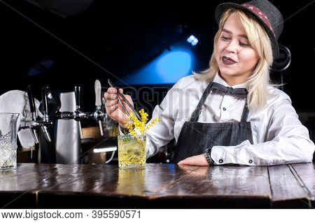 Girl Barman Makes A Cocktail On The Porterhouse