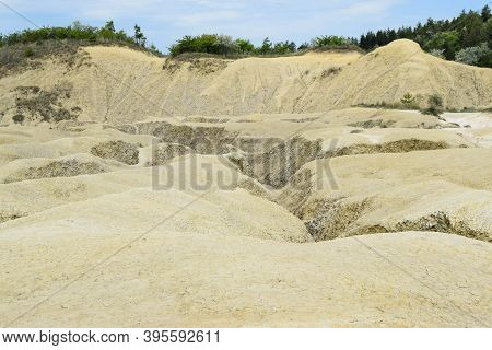 Panoramic Scenic Landscape Of Mud Volcano At Paclele Mari, Romania, Deserted Valley On Foreground In