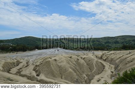 Landscape With Cracked Soil From Mud Volcanoes, At Paclele Mari, Romania. Volcanic Rocks And Lava Of