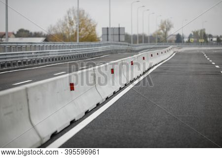 Shallow Depth Of Field (selective Focus) Image With Concrete Jersey Barriers (jersey Walls Or Jersey