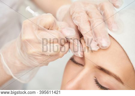 Forehead Injection At Spa Salon. Doctor Hands. Closeup. High Quality. Pretty Female Patient. Beauty 