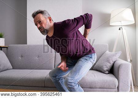 Older Senior Man With Back Pain Or Backpain