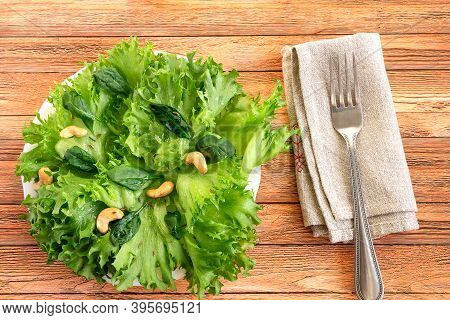 Fresh Green Leafy Salad With Cashew Nuts For A Healthy Diet And Nutrition.