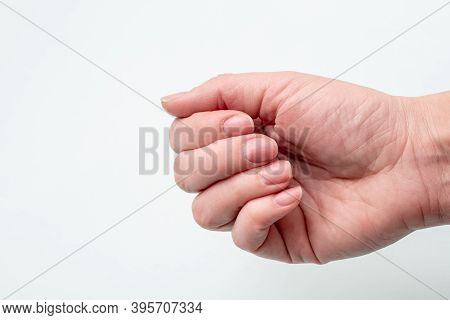 Concept For Natural Nails, Raw Nails. Close-up Of Caucasian Female Hand With Natural Unpolished Nail