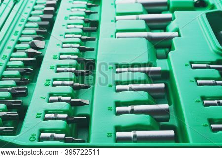 Mechanics Tool Set And Mechanic's Tool Box Close-up. Plastic Green Storage Box Case. Mechanics Tool