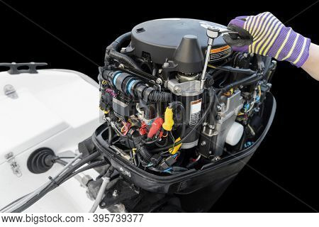 Repairing  Outboard Marine Engine. Motorboat Engine Seasonal Service And Maintenance. Mechanic Yfnd