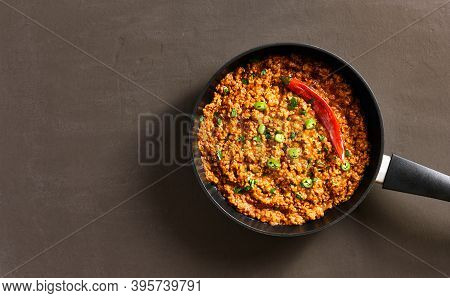 Keema Curry In Frying Pan Over Dark Background With Copy Space. Indian And Pakistani Style Dish. Top