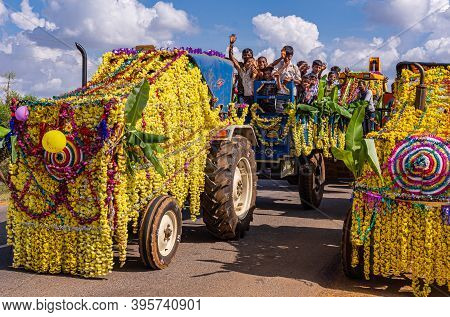 Mudrapura, Karnataka, India - November 3, 2013: Kids On Yellow Flowerly Decorated Agricultural Vehic