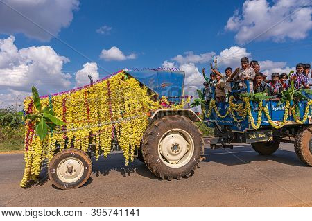 Mudrapura, Karnataka, India - November 3, 2013: Yellow Flowerly Decorated Agricultural Vehicles Full