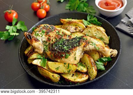 Spatchcocked Grilled Chicken And Fried Potato Wedges On Plate