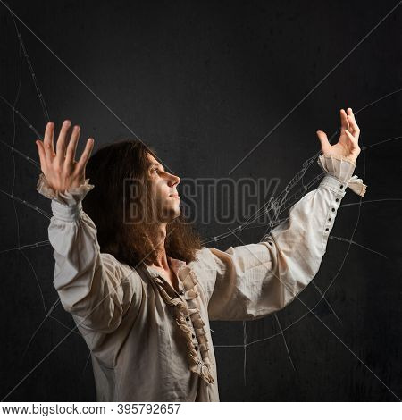 Young Man In Medieval Clothes In The Image Of Da Vinci, Dreams Of Flight, A Sketch Of A Mechanical W