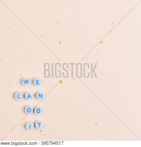White WE CAN DO IT beads message typography