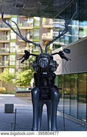 Oslo, Norway - Aug. 29th 2020: Abstract Sculpture, Deer Mixed With A Classical Motorcycle In An Urba