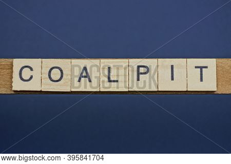 Gray Word Coalpit From Small Wooden Letters On A Black Table