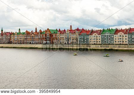 Yoshkar-ola, Mari El, Russia 30 July 2020: Arkhangelskaya Sloboda Quay Bruges Flemmish Houses, Boats