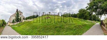 Checiny, Poland - September 06, 2020: Panoramic View Of The Royal Castle And The Parish Church Of St
