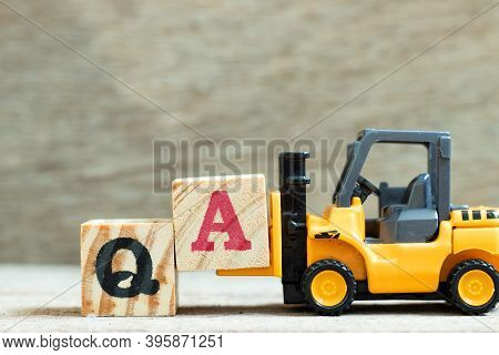 Toy Forklift Hold Letter Block A To Complete Word Qa (abbreviation Of Quality Assurance Or Question 
