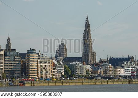 Cityscape Of A Port Of Antwerp And Cathedral Of Our Lady In Belgium Over The River