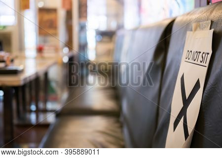 Social Distancing Seating In Restaurant For Prevent Risk Of Transmission Covid-19. Close-up View Of 