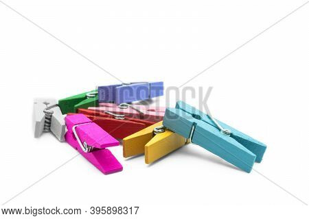 Colorful Wooden Clothespins Isolated On The White Background.