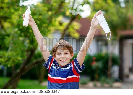 School Kid Boy With Medical Mask As Protection Against Pandemic Coronavirus Quarantine Disease. Chil