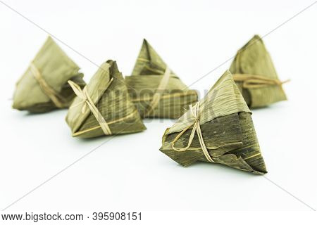 Closeup View Of The Zongzi (sticky Rice Dumplings), It Is A Traditional Chinese Rice Dish Made Of Gl