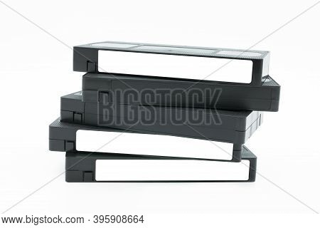 Stack Of Vhs Video Tape Cassette Isolated On White Background.