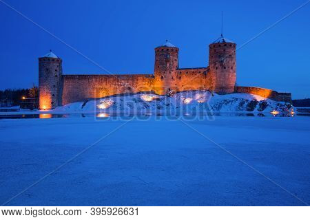 The Old Fortress Of Olavinlinna (olafsborg) Is Close-up In March Twilight. Savonlinna, Finland