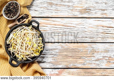 Bowl With Mungbean Sprouts On Wooden Background. White Background. Top View. Copy Space