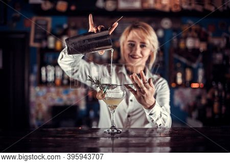 Girl Barman Concocts A Cocktail On The Porterhouse
